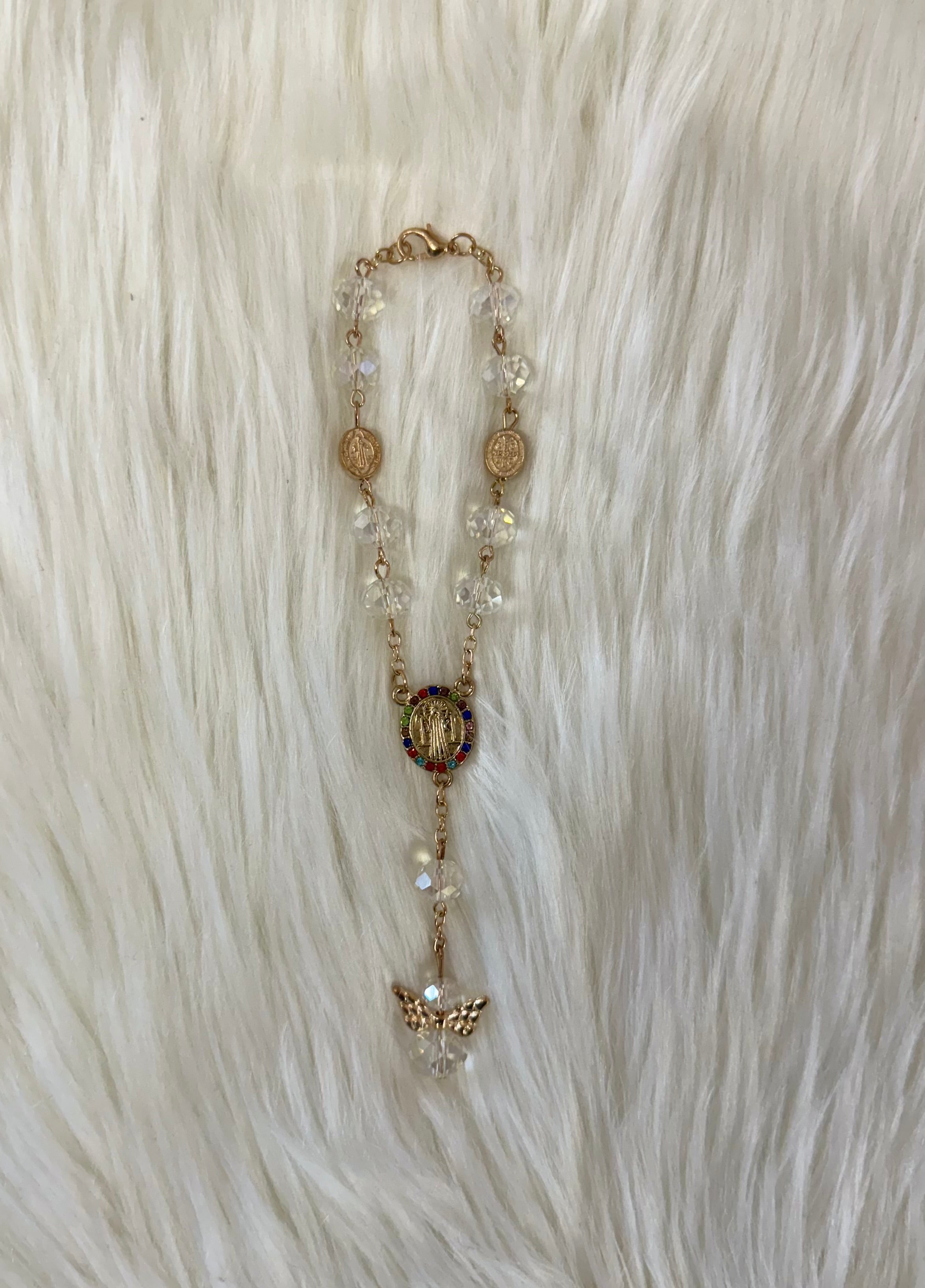 Clear beaded rosary bracelet favors with gold accents and rainbow rhinestones